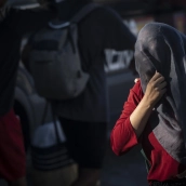 Varios inmigrantes en una playa, a 21 de agosto de 2026
