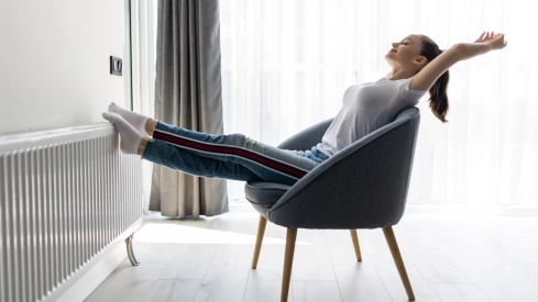 young woman relaxing modern chair home