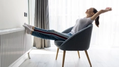 young woman relaxing modern chair home