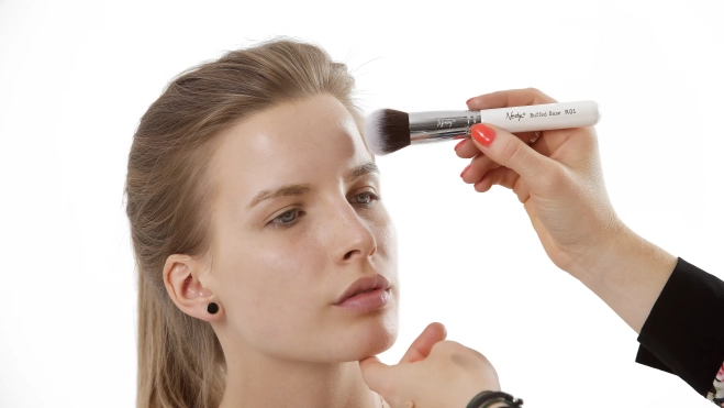 A person applying makeup. Source: Image by Nanshy on Pixabay.